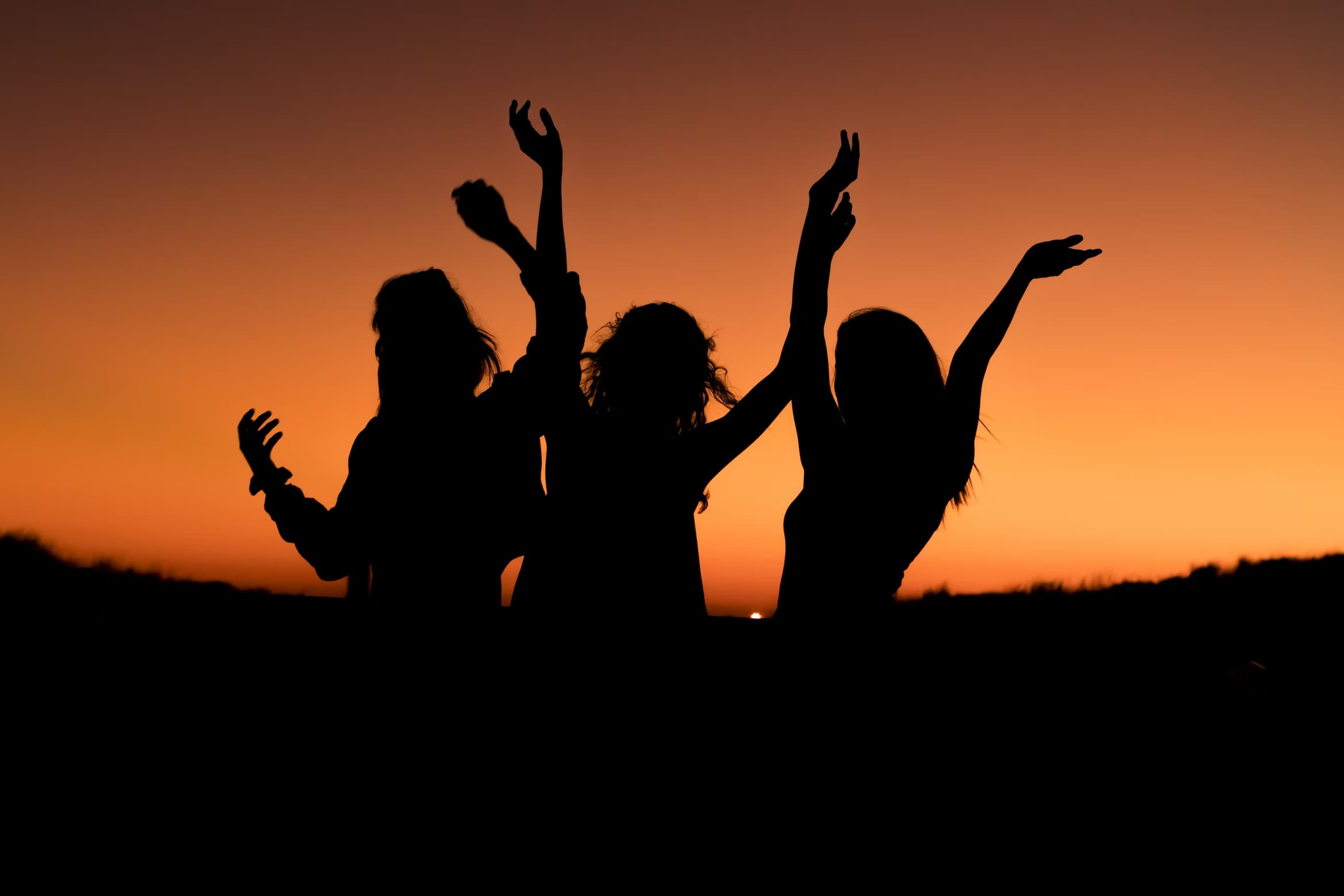 3 girls watching sunset