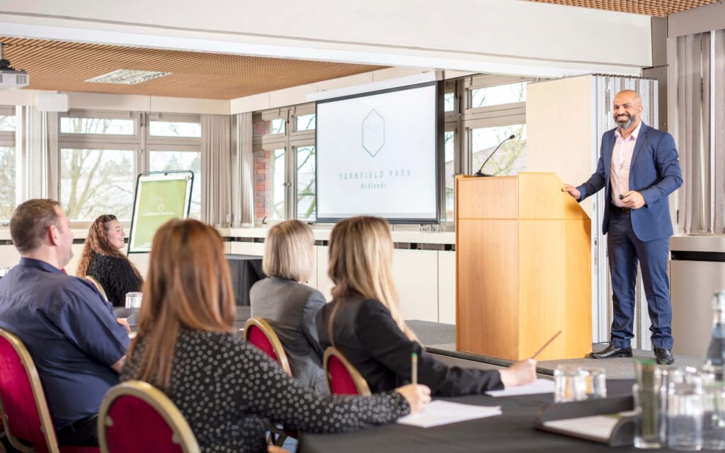 man giving speech at conference