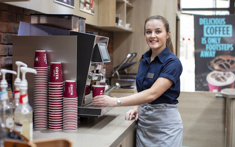 member of staff at costa coffee cafe