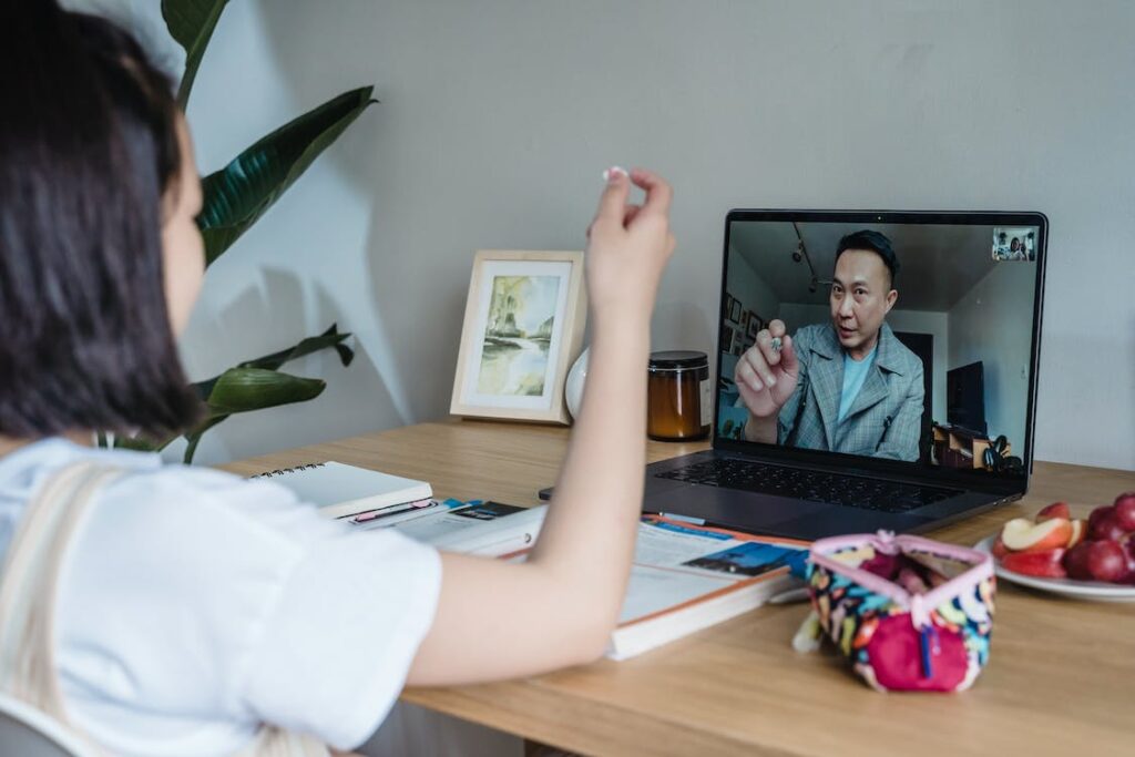 woman on training call on laptop