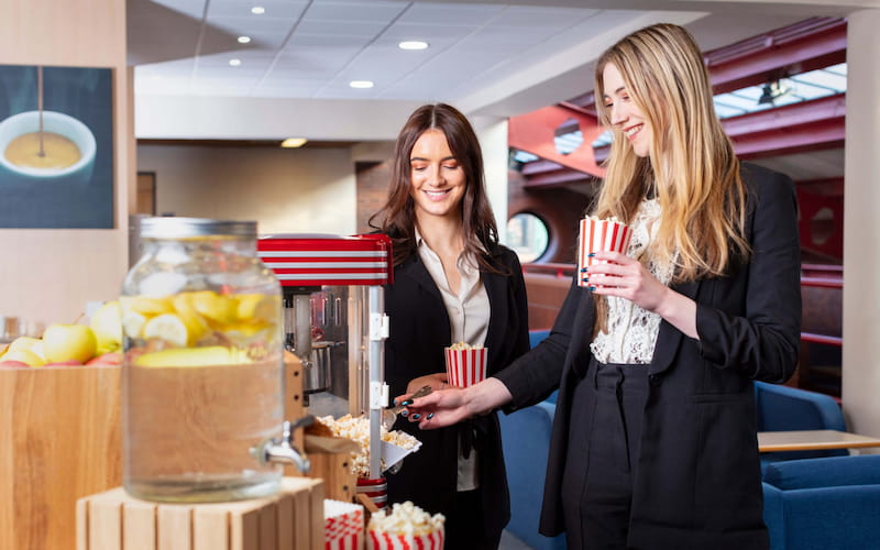 two women at a refreshment bar at Yarnfield Park